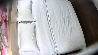 Cute amateur asian web cam girl playing with her toy