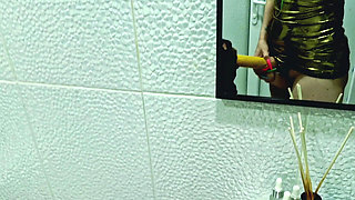 A slave is cleaning a dirty toilet when Dominatrix Nika comes to him with a strap-on and makes him take the strap-on in his mout