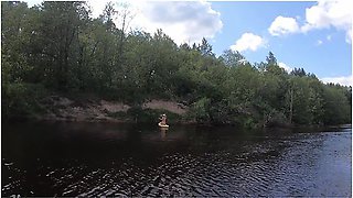 Girl On A Hiking Trip On A Sup Board