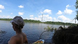Big-Ass Blonde Rides a SUP Board Naked on a Beach