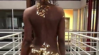 African Girl Wearing Gold Walks