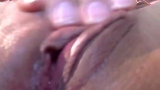 Mature in red heels masturbates in a close-up video with her sex toys