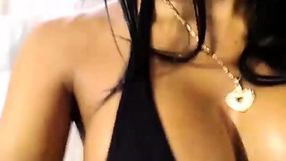 Busty babe playing with her big boobs