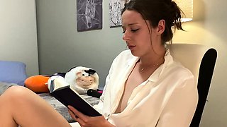 Voyeur of sexy brunette reading a hot romance novel and