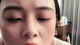 Horny Japanese teen in school uniform sucks cock