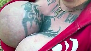 Blonde is flashing her big boobs in the outdoors