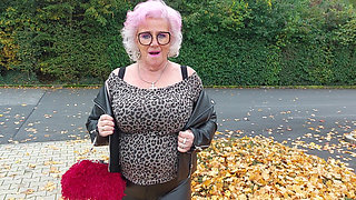 Naughty Granny Tongue Out Flashing Big Tits in Public
