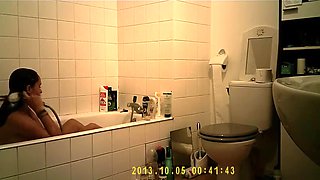 Brunette uses the toilet and takes a shower