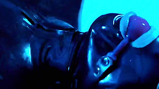 Tied up rubber girl in catsuit fucking herself