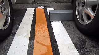 Asian peeing on street