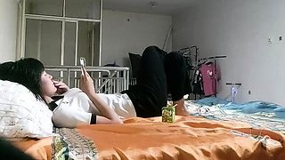 Cute amateur asian web cam girl playing with her toy