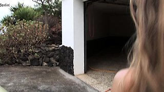 Outdoor solo masturbation scene with curly blonde