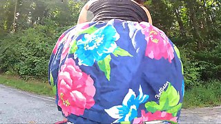 Butt plugged wife rides bike in the park and shows her toy