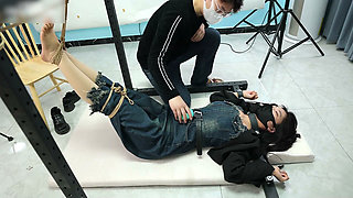 My Girlfriend Was Tied to an Iron Frame, Her Bare Feet Suspended and Tickled
