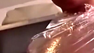 Plastic Wrapped Slut Gaping Wide Through Shiny Film