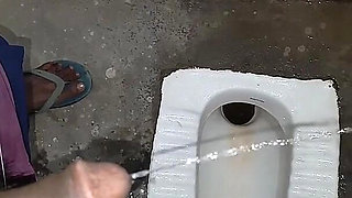 Desi Bhabhi Holding Stepbrother-in-law's Penis and Making Him Pee and Peeing Herself