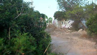 In a kitchen a sexy brunette playing with her big boobs