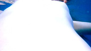 Ariel Ortiz likes to swim in the pool, while her neighbor sees her wank. She is a stunning sandy-haired, who likes to be observed in the pool