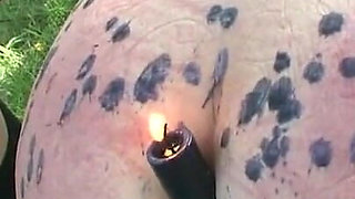 Humiliating candle dripping on ass