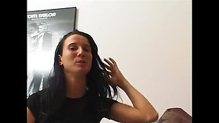 Brunette slut fingers her wet pussy on casting couch
