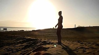 French amateur girl blows on a public beach