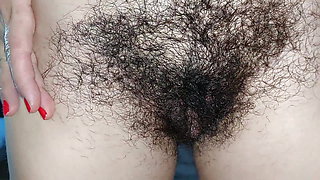 Hot mom fingers her hairy pussy, big breasts, big nipples. Sexy Latina satisfies herself, hairy ass, big breasts, long hair.