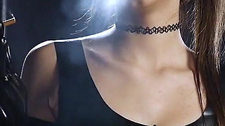 Brunette Smoking in Black Latex Outfit Slow Sensual Scene