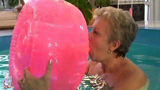 Gorgeous mature blonde Jitka is touching her shaved pussy in the pool