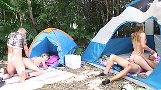 Alyssa and Haleydog it in the woods with Jimmy
