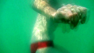 My tits underwater on public beach