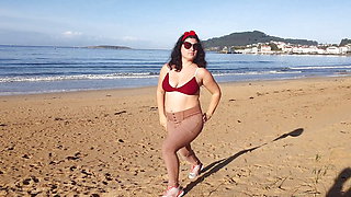 Woman Pissing on a Public Beach While No One Is There