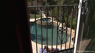 Hairy girl Nina Devon lays out by the pool - WeAreHairy